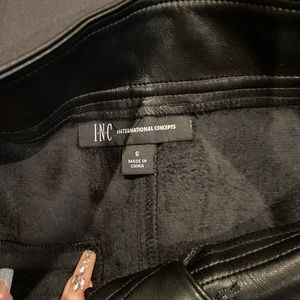 Never worn faux leather pants .